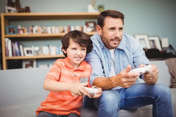 Father and son playing video game