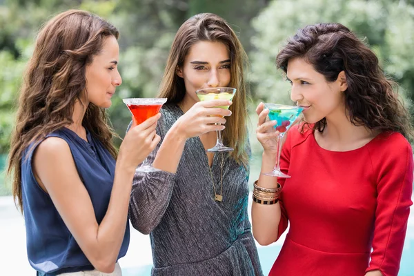 Female friends drinking cocktails