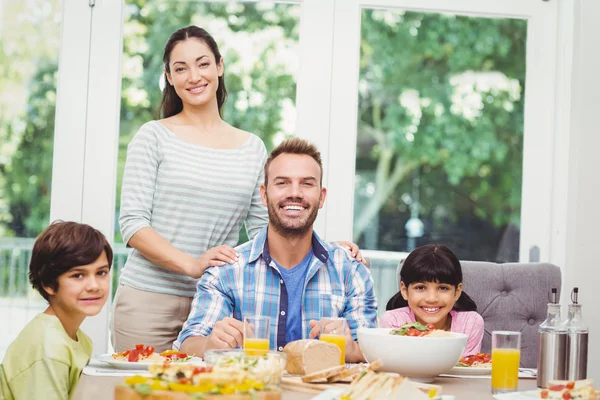 Cheerful family at dining table