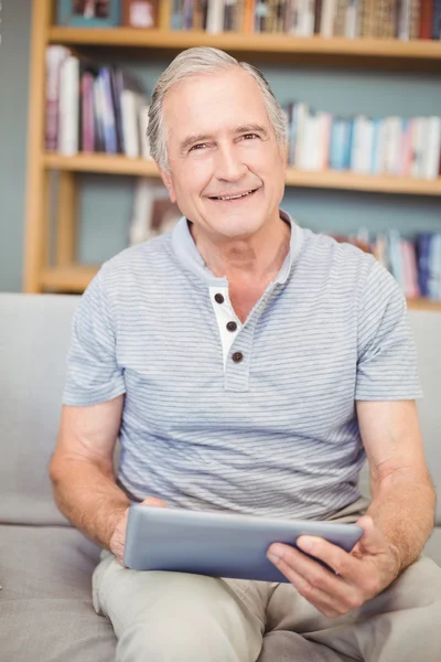 Senior man using digital tablet