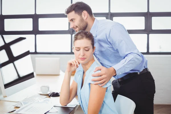 Businessman harassing female colleague