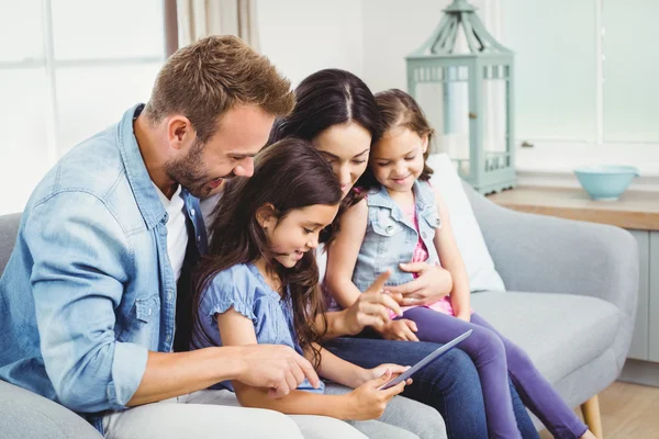 Family looking in digital tablet