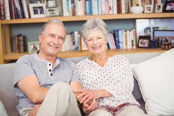 Senior couple sitting in living room