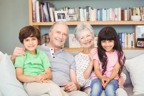Grandchildren with grandparents at home