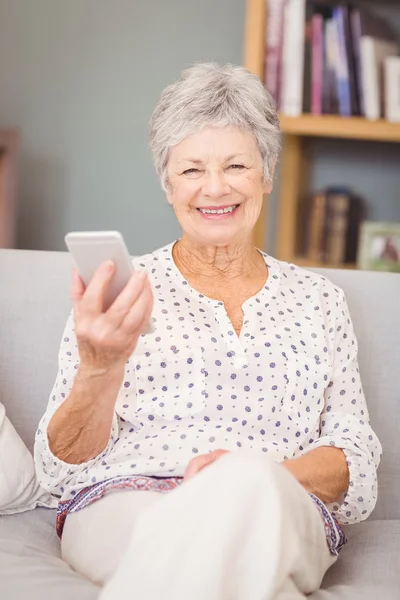 Senior woman holding mobile phone