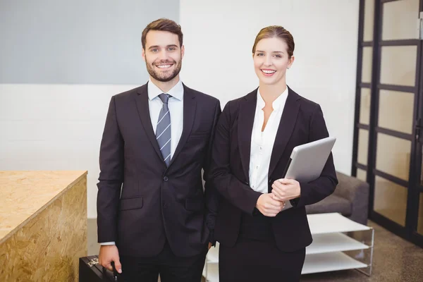 Business people standing by counter