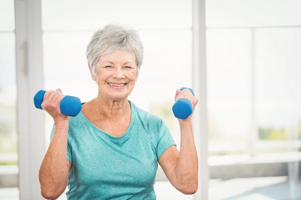 Woman holding dumbbell