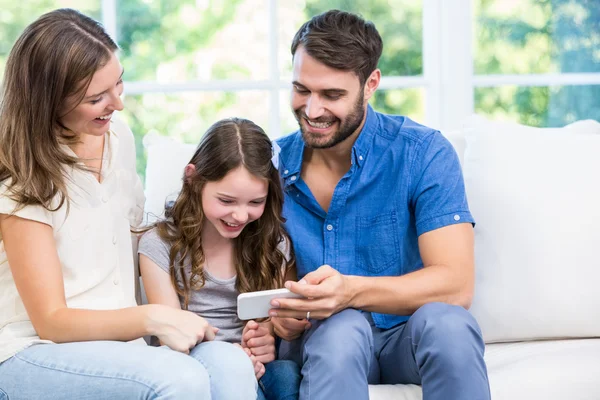 Family looking at smart phone