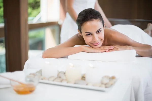 Woman receiving massage at health spa