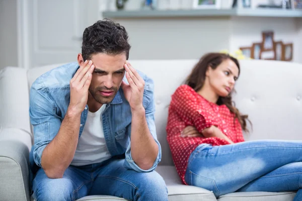 Tensed man after argument with woman