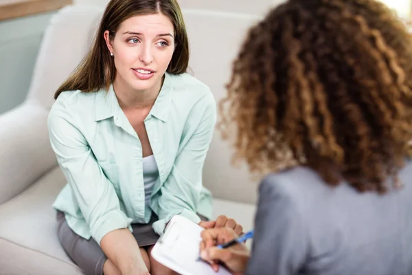 Woman discussing problems with psychologist