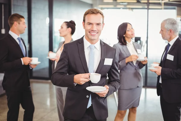 Businessman having tea