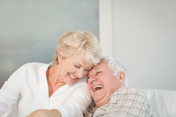 Happy senior couple laughing