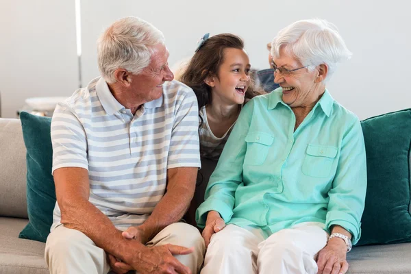 Grandmother and grand father with their granddaughter