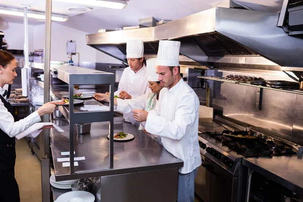 Chef preparing food in commercial kitchen