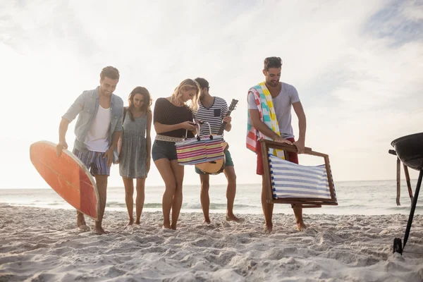 Happy friends bringing their stuff