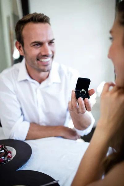 Man proposing to woman engagement ring