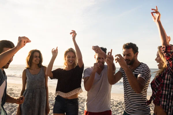 Happy friends dancing together