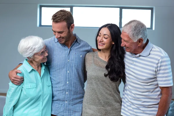 Young couple with their grandparents