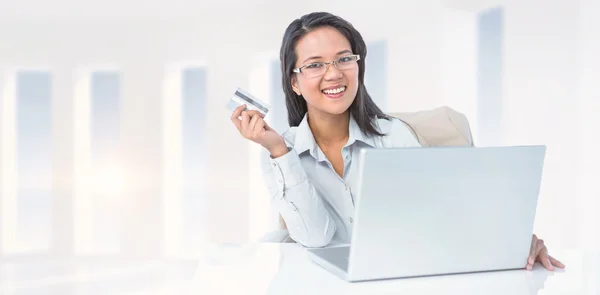 Businesswoman holding credit card