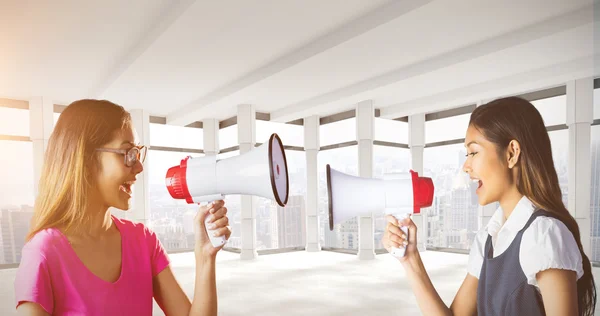 Businesswoman shooting through a megaphone