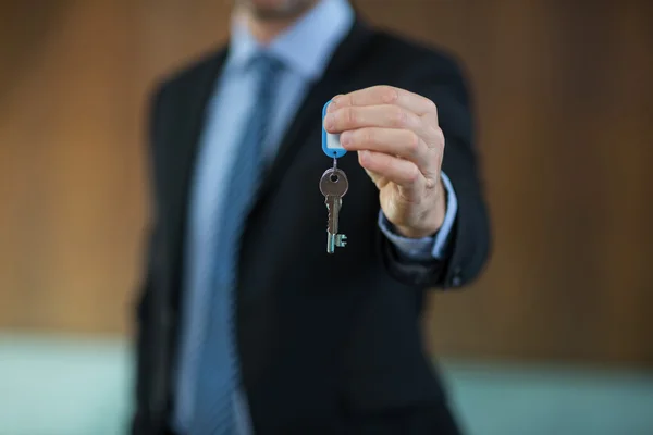 Real estate agent holding key