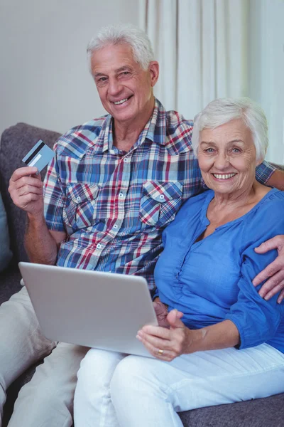 Couple with credit card and laptop