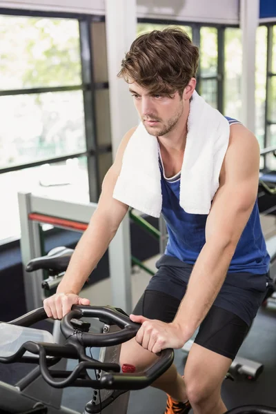 Man working out on exercise bike