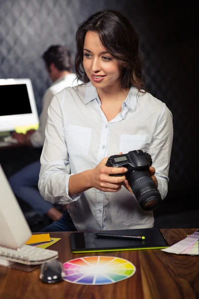 Creative businesswoman looking at pictures