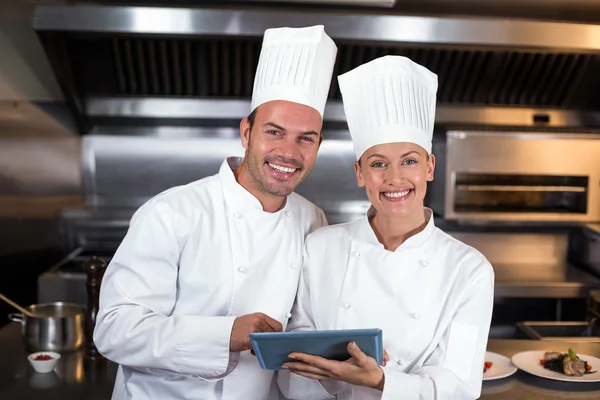 Chefs holding clipboard