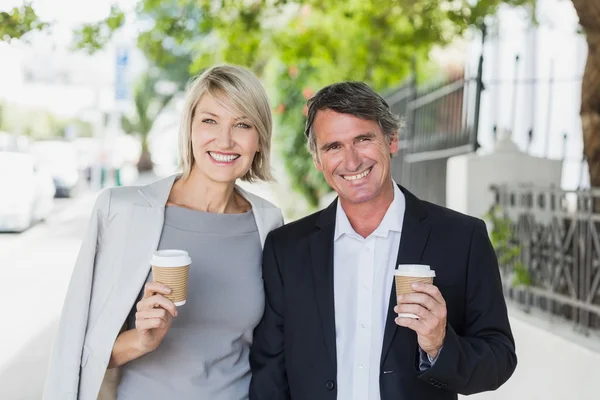 Happy business people with coffee