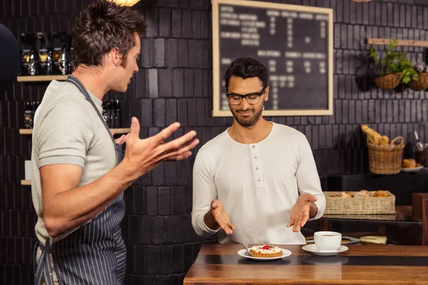 Waiter and customer having a discussion