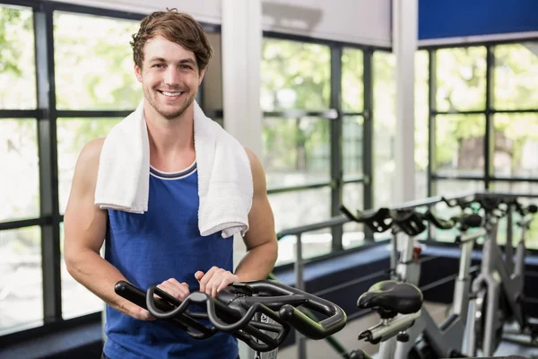 Man standing in spinning class