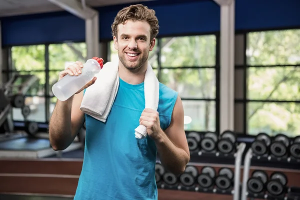 Man having water after workout