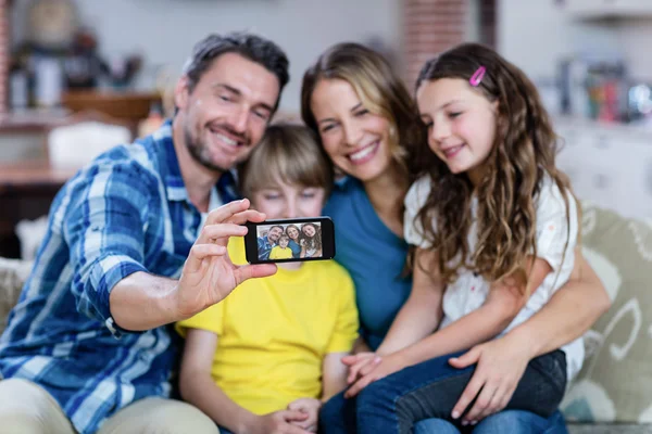 Family taking selfie on mobile phone