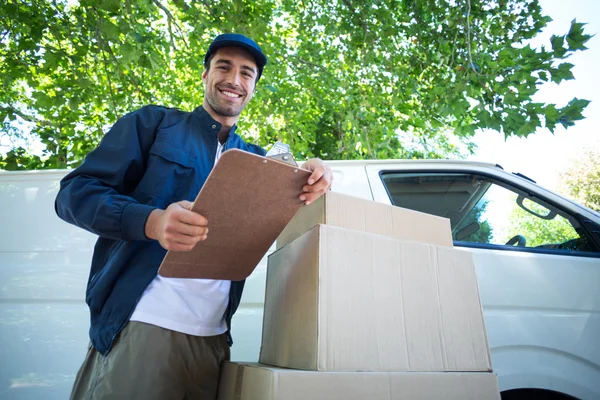 Delivery man holding clipboard