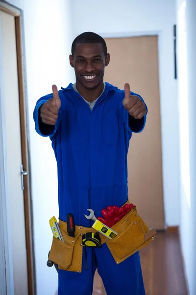 Handy man showing his thumbs up