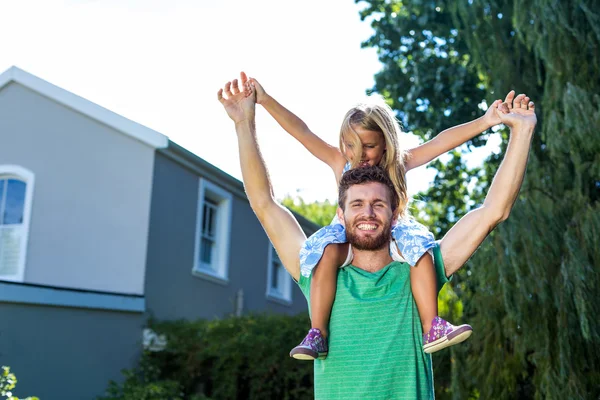 Father carry daughter on shoulders