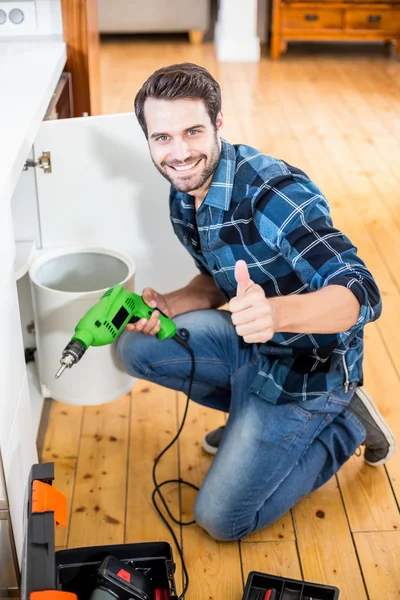 Man holding drill machine