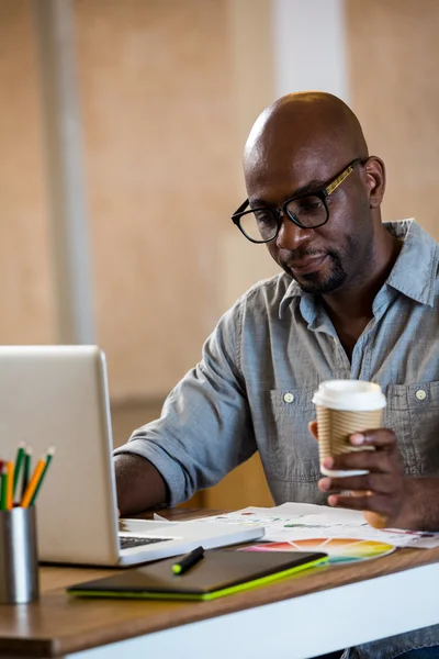 Graphic designer using laptop