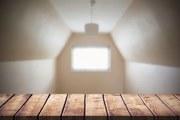 Empty attic room in cream and beige