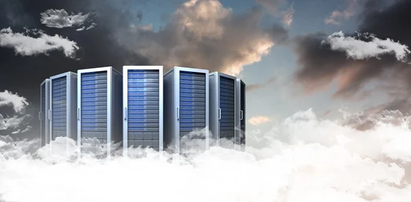 Server towers against sky with clouds
