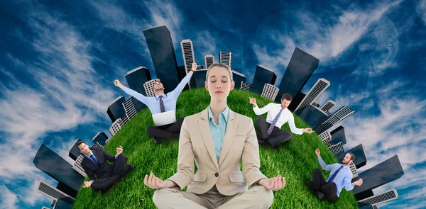 Businesspeople sitting in lotus position