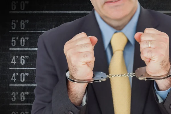Businessman with handcuffed hands