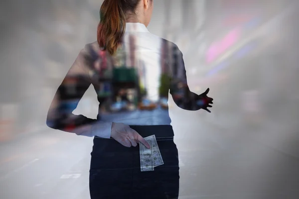 Businesswoman offering handshake with fingers crossed