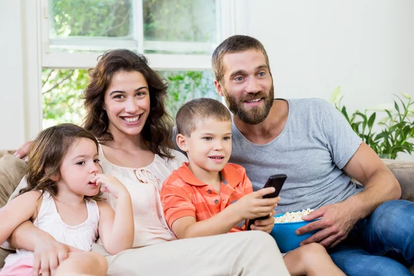 Family having fun while watching television