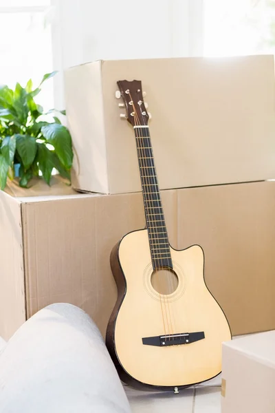 Guitar and cardboard boxes