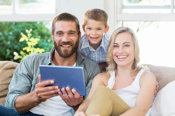 Parents and son using digital tablet