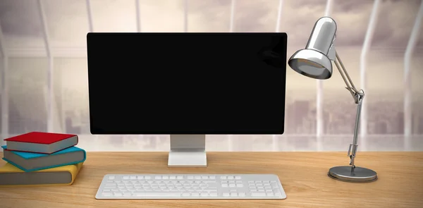 Computer on desk and light lamp