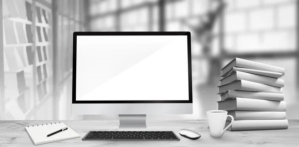 Desk with computer and books